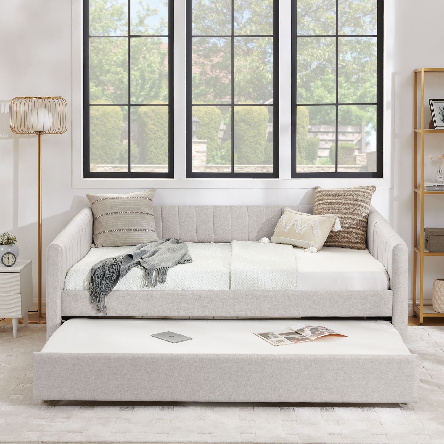 Beige full-size upholstered daybed with pull-out trundle