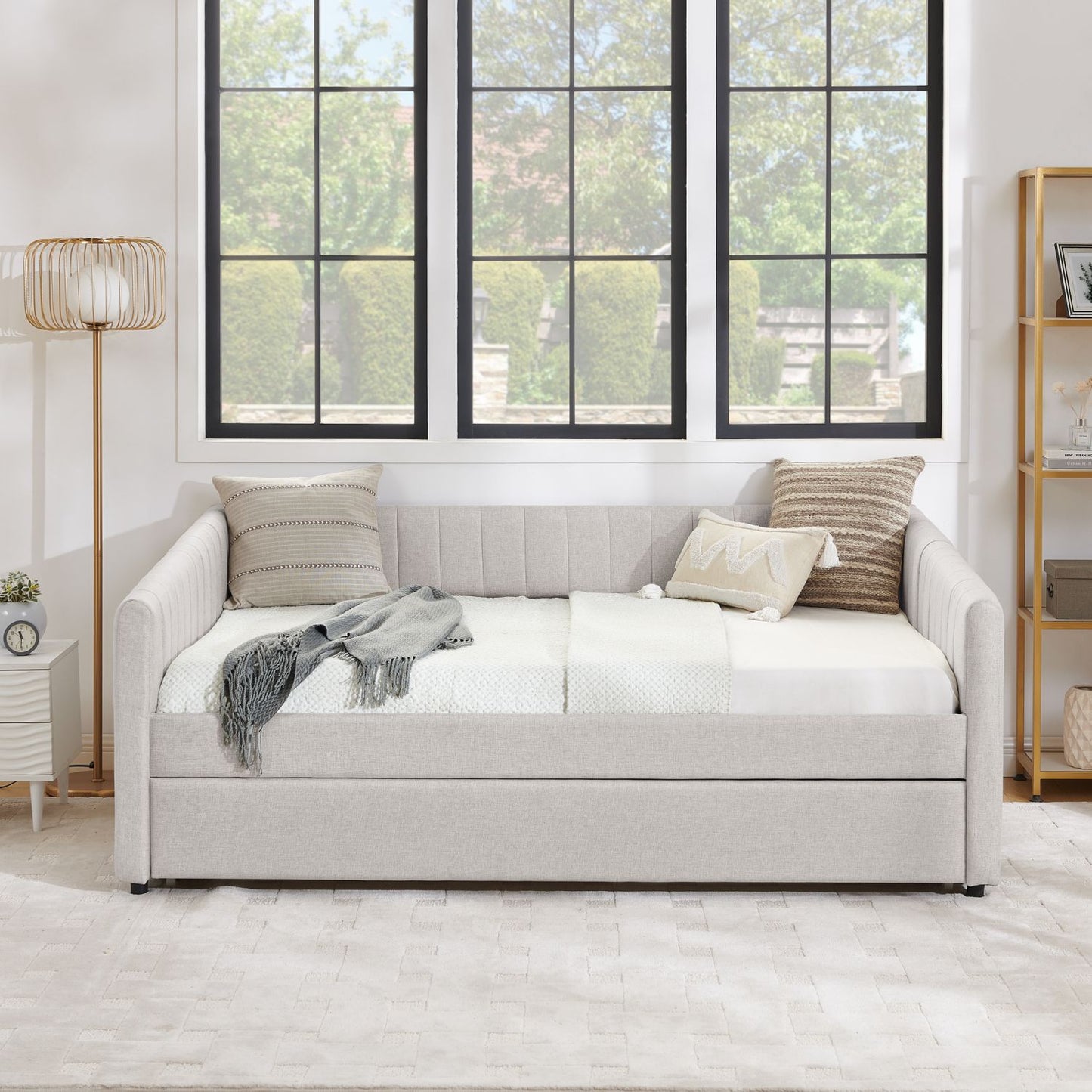 Beige full-size upholstered daybed with pull-out trundle