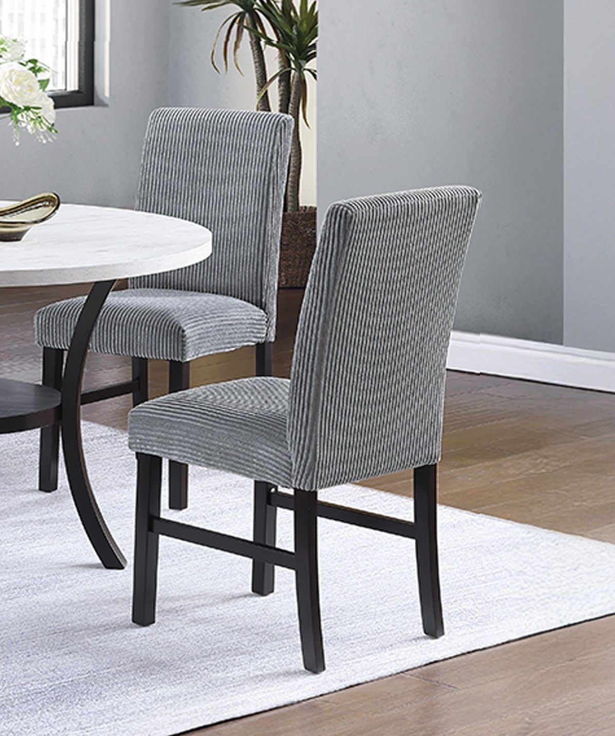 Modern dining chairs with textured fabric and solid wood frame
