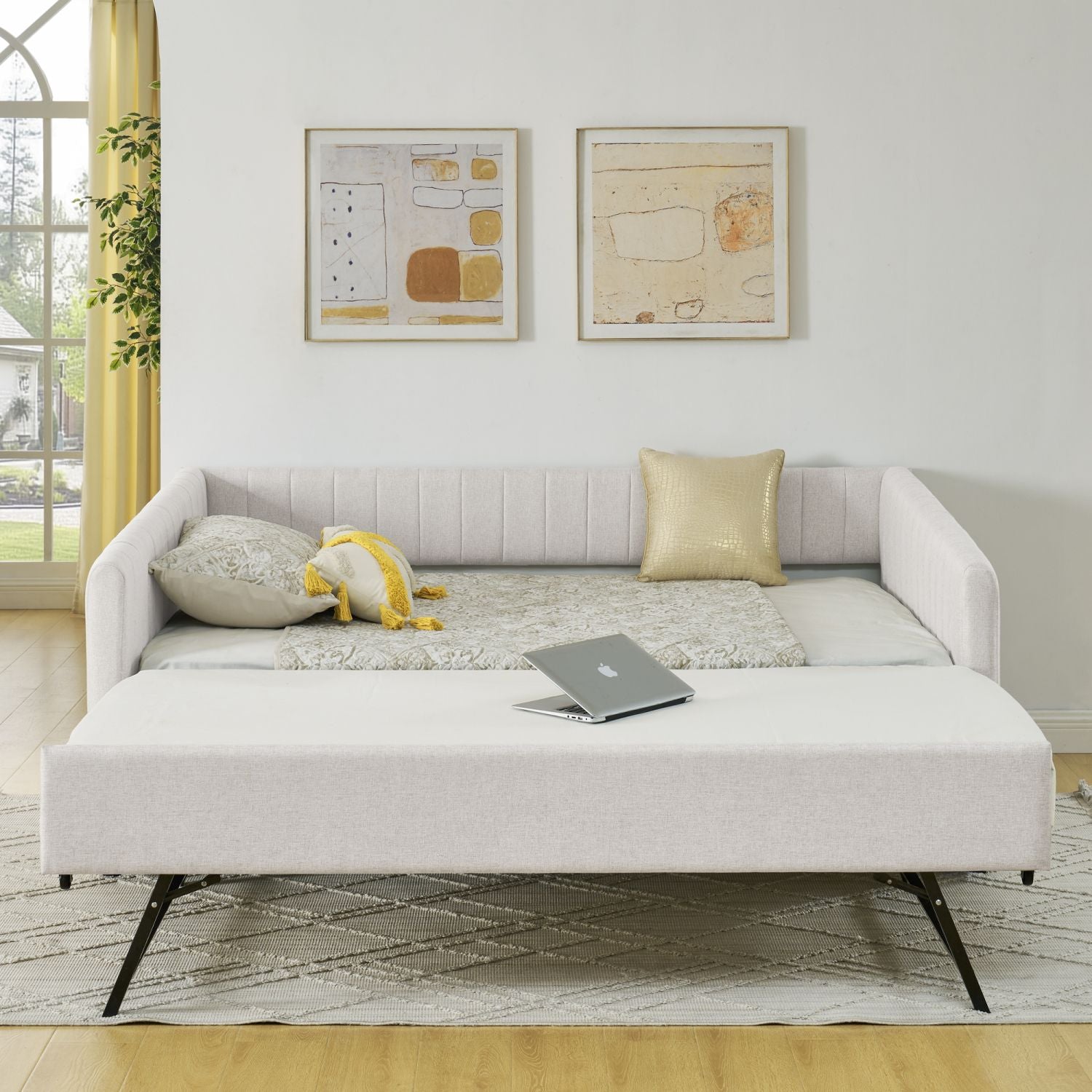Beige full-size upholstered daybed with pull-out trundle