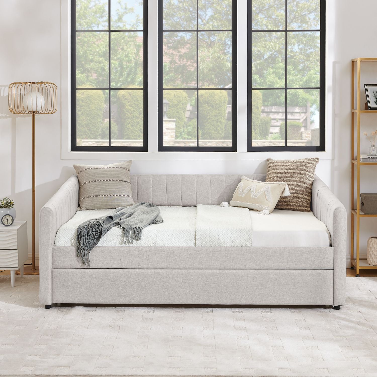 Beige full-size upholstered daybed with pull-out trundle