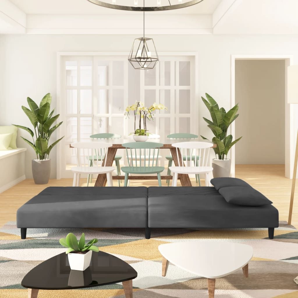 Dark gray velvet 2-seater sofa bed with pillows